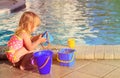 Cute little girl playing in swimming pool at beach Royalty Free Stock Photo