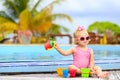 Cute little girl playing in swimming pool at beach Royalty Free Stock Photo