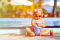 Cute little girl playing in swimming pool at beach Royalty Free Stock Photo