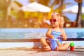 Cute little girl playing in swimming pool at beach Royalty Free Stock Photo