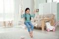 Cute little girl playing on swing Royalty Free Stock Photo