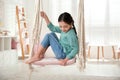 Cute little girl playing on swing Royalty Free Stock Photo