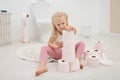 Cute little girl playing with toilet paper Royalty Free Stock Photo