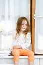 Cute little girl playing with toilet paper roll Royalty Free Stock Photo