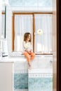 Cute little girl playing with toilet paper roll Royalty Free Stock Photo