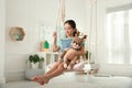 Cute little girl playing with toy deer on swing Royalty Free Stock Photo