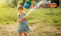 Cute little girl playing water gun Royalty Free Stock Photo