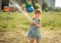 Cute little girl playing water gun Royalty Free Stock Photo