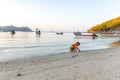Cute little girl plays on the beach in Thailand Royalty Free Stock Photo