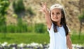 cute little girl plays outdoors on the summer , and walks around the park, happy childhood