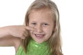 Cute little girl pointing her nose in body parts learning school chart serie Royalty Free Stock Photo