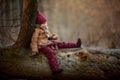 Cute little girl portrait in a spring forest at cloudy day Royalty Free Stock Photo