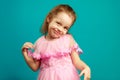 Cute little girl posing in dress ahead isolated blue Royalty Free Stock Photo