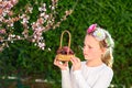 Cute little girl posing with fresh fruit in the sunny garden. Little girl with basket of grapes. Royalty Free Stock Photo