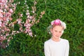 Cute little girl posing with fresh fruit in the sunny garden. Royalty Free Stock Photo