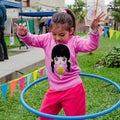 Cute little girl posing with her hula hoop Royalty Free Stock Photo
