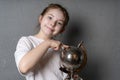 Cute little girl of pre-adolescence holding a metal globe in her hands. Royalty Free Stock Photo