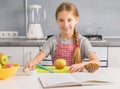 Cute little girl preparing to cook apple strudel