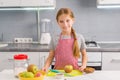 Cute little girl preparing to cook apple strudel