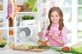 Little girl preparing vegetable salad Royalty Free Stock Photo