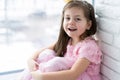 Cute little girl in a princess costume. Pretty child preparing for a costume party. Beautiful queen in gold crown. Royalty Free Stock Photo