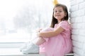 Cute little girl in a princess costume. Pretty child preparing for a costume party. Beautiful queen in gold crown. Royalty Free Stock Photo