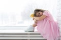 Cute little girl in a princess costume. Pretty child preparing for a costume party. Beautiful queen in gold crown. Royalty Free Stock Photo