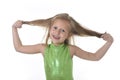 Cute little girl pulling blonde hair in body parts learning school chart serie