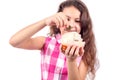 Cute little girl puts a coin in a pig-piggy bank Royalty Free Stock Photo