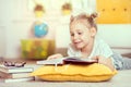 Cute little girl read book at home Royalty Free Stock Photo