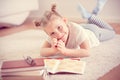 Cute little girl read book at home Royalty Free Stock Photo