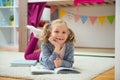 Cute little girl read book at home Royalty Free Stock Photo