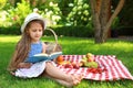 Cute little girl reading book outdoors Royalty Free Stock Photo