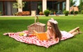 Cute little girl reading book. Summertime rest Royalty Free Stock Photo