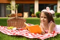 Cute little girl reading book. Summertime rest Royalty Free Stock Photo