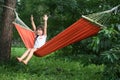 Cute little girl relaxing in hammock on summer day Royalty Free Stock Photo