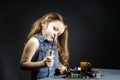 Cute little girl repair electronics by cooper-bit Royalty Free Stock Photo