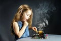 Cute little girl repair electronics by cooper-bit Royalty Free Stock Photo