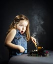 Cute little girl repair electronics by cooper-bit Royalty Free Stock Photo
