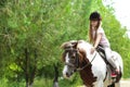 Cute little girl riding pony Royalty Free Stock Photo