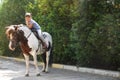 Cute little girl riding pony Royalty Free Stock Photo