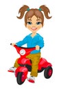 Cute little girl riding a tricycle