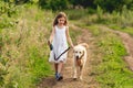 Cute little girl running with dog Royalty Free Stock Photo