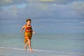 Cute little girl on sandy beach Royalty Free Stock Photo