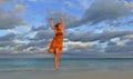 Cute little girl on sandy beach in sunset light. Royalty Free Stock Photo