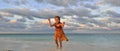 Cute little girl on sandy beach in sunset light. Royalty Free Stock Photo