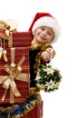 Cute little girl in a Santa Claus cap with Christmas gifts, isolated Royalty Free Stock Photo