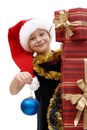 Cute little girl in a Santa Claus cap with Christmas gifts, isolated Royalty Free Stock Photo