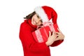 Cute little girl with Santa hat hugging her present