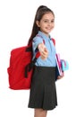 Cute little girl in school  with backpack and stationery showing thumbs-up on white background Royalty Free Stock Photo